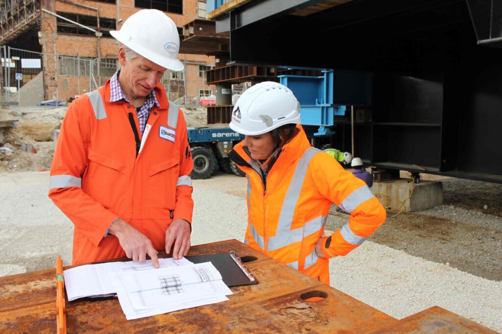 two construction workers reviewing plans